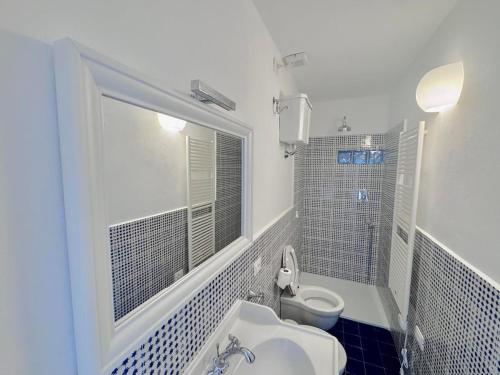 a bathroom with a sink and a toilet at La Torre in San Vincenzo