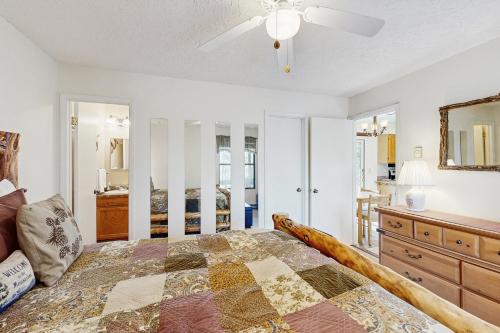 a bedroom with a bed and a ceiling fan at Misty Woods #4 in Sugar Mountain