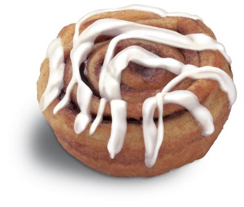 a pastry with white frosting on top of it at Holiday Inn Express Hotel & Suites Bloomington-Normal University Area by IHG in Bloomington