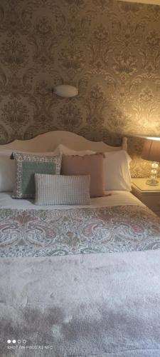 a bedroom with a bed with pillows on it at Ashleigh House Bed & Breakfast in Monaghan