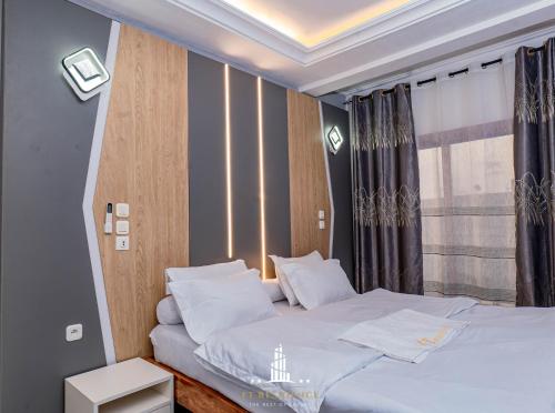 Postel nebo postele na pokoji v ubytování FT Residence