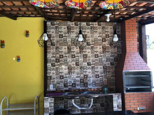 a wall with a wall with pictures on it at Casa em Alter do Chão in Santarém