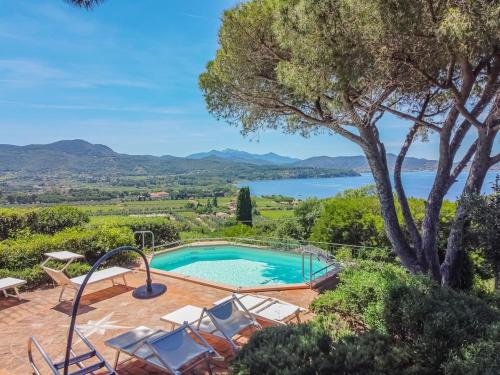 a villa with a swimming pool and a view at Villa Les Ombrelles in Portoferraio