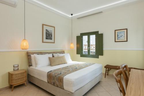 a bedroom with a large bed in a room at Ocean Caldera View Villa by Dalmyra Estate in Imerovigli