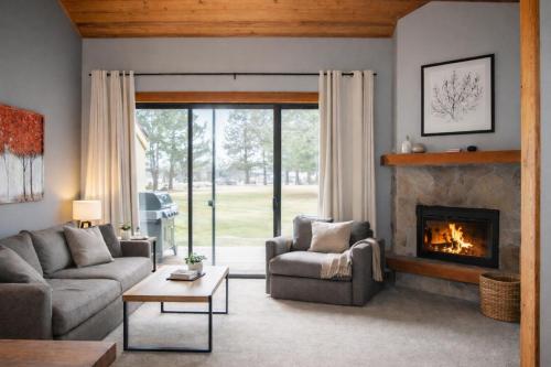 a living room with a couch and a fireplace at Lodge Condo 031 in Black Butte Ranch