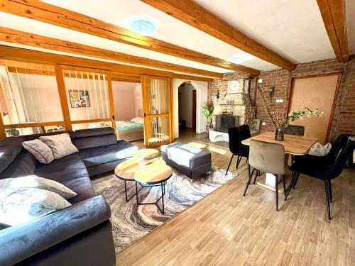 a living room with a couch and a table at Apartmani Megara Vlasic in Šišava
