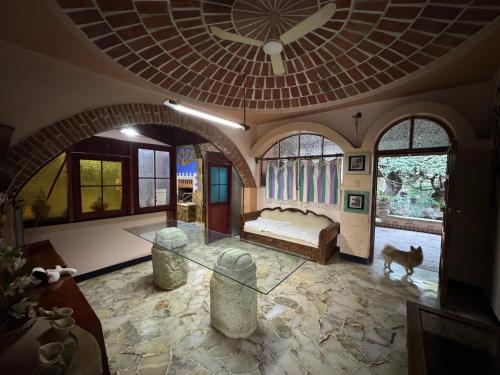 a bedroom with a bed and a dog in it at Hacienda Cordova in San Sebastián Etla