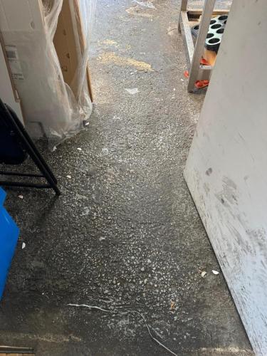 a dirty floor with debris on the floor of a room at Résidence Le Petit Manoir in Cotonou