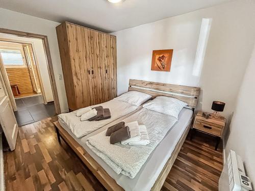 a bedroom with a bed with two towels on it at Ferienwohnung W18 0 N in Graal-Müritz