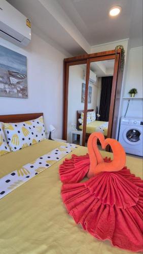 a bedroom with a bed with a heart on it at PB325 Ideal studio apartment in Phuket in Ban Mai Salae