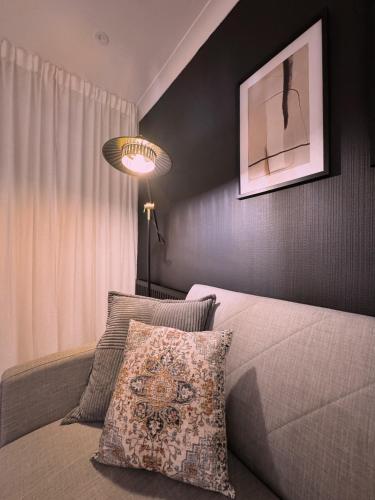 a bedroom with a bed with a pillow and a lamp at Wildoaks in Northwood