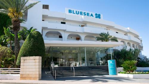 a large white building with a sign on it at BLUESEA Ses Cases d'Or in Cala d´Or