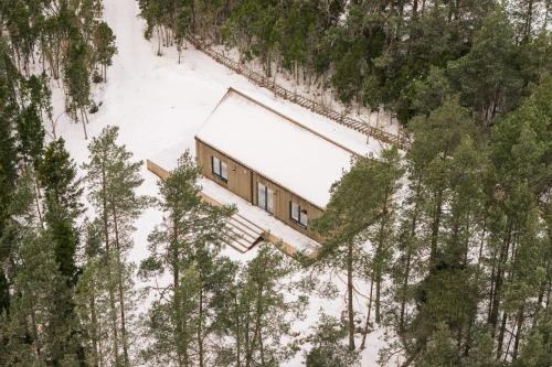 an aerial view of a house in the snow at Charming Seaside Country Cottage in Myza Lakhetaguze