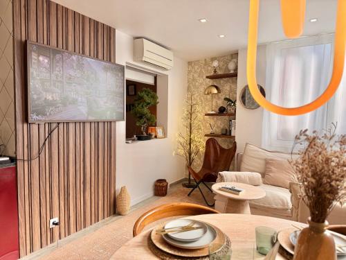 a living room with a flat screen tv on a wall at FM Herculano - Sea, Sun & Fun in Cascais