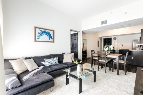 a living room with a couch and a table at Brilliant 2BD condo in Los Angeles
