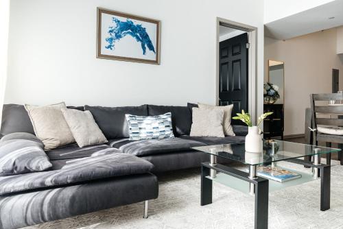 a living room with a couch and a glass table at Brilliant 2BD condo in Los Angeles