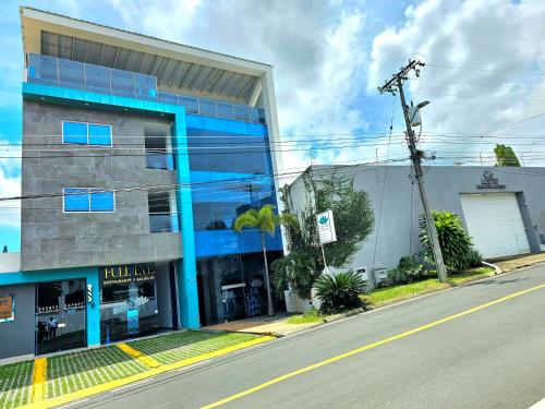 an empty street in front of a building at Hotel Lotto Boutique in Cali