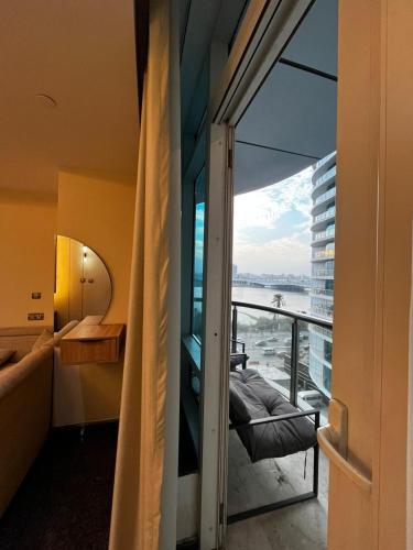 a room with a balcony with a view of the water at Crown Mountain in 6th Of October