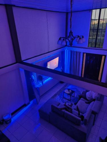 a living room with a couch and an aquarium at Optimum Apartments in Providence