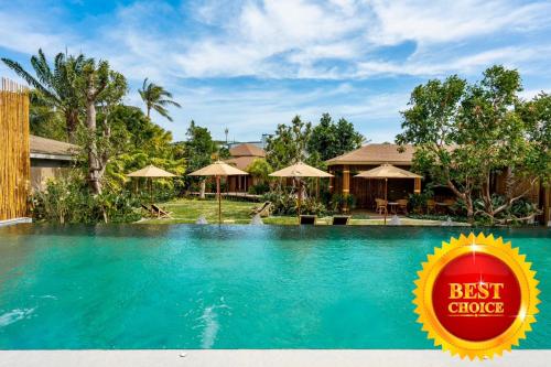 a swimming pool at a resort with a best choice sign at Chaykha Retreat
