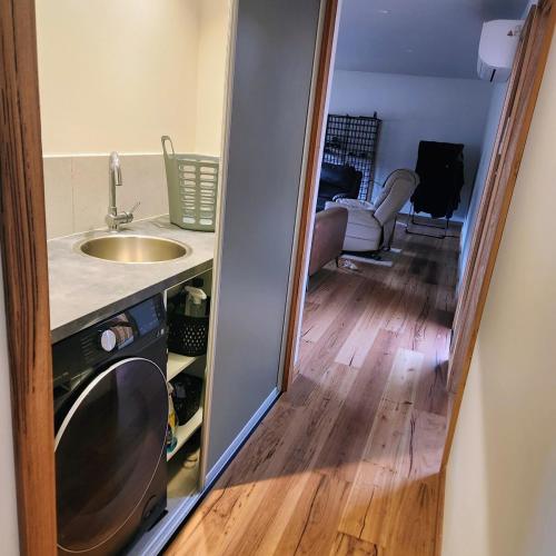 a small kitchen with a sink and a counter at Prosser River view from Paradise in Orford