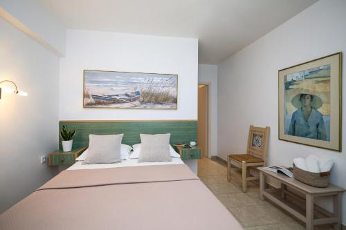 a bedroom with a large bed in a room at Leonardos Apartments in Naousa