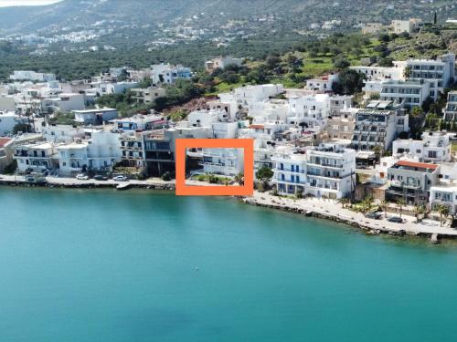 an orange square in the middle of a city over water at Kristallia - Elounda seafront vacation rental in Elounda