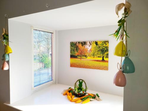 a window in a room with a picture on the wall at Parkside Apartment Normanton in Wakefield