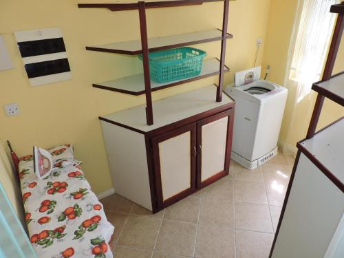 Postel nebo postele na pokoji v ubytování Villa Hibiscus