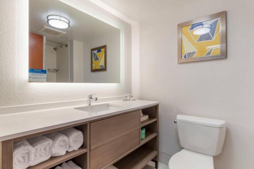 a bathroom with a sink and a toilet at Comfort Suites Columbia Northeast - Fort Jackson in Dentsville