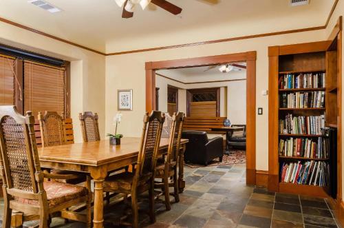 a dining room with a wooden table and chairs at Hotel Napa Valley, an Ascend Collection Hotel in Napa