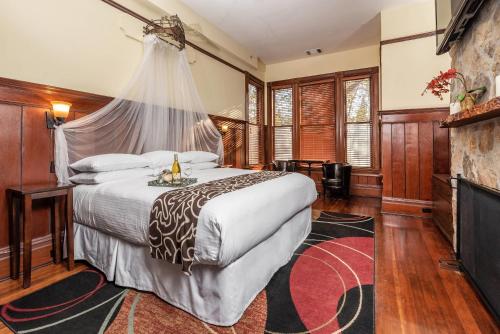 a bedroom with a bed with a mosquito net at Hotel Napa Valley, an Ascend Collection Hotel in Napa