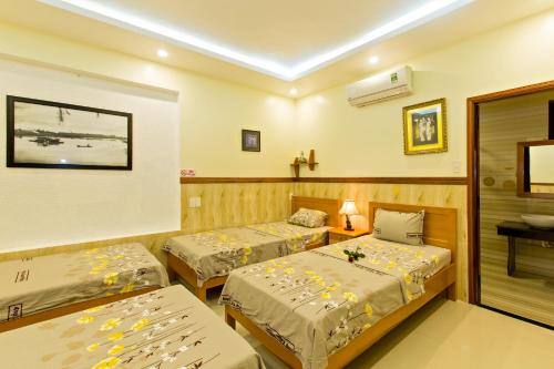 Postel nebo postele na pokoji v ubytování Qua Cam Tim Homestay