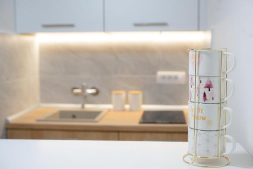a vase sitting on a counter in a kitchen at Studio H&M in Užice
