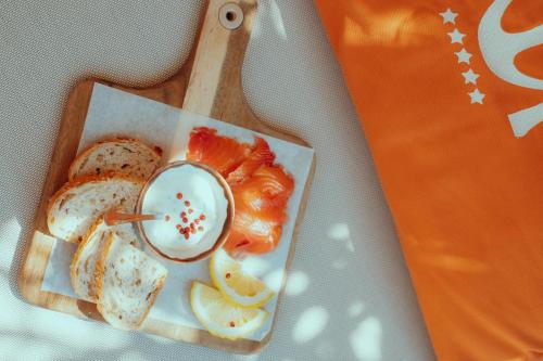 a plate of food with bread and a dip at Maison Nova - Boutique Hôtel & Spa in Collioure