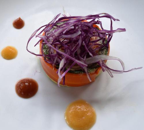 a doughnut with purple onions on top of it at Sala Baï Hotel & Restaurant School in Siem Reap