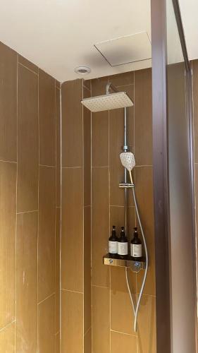 a bathroom with a shower with a shower head at Diver's home resort in Panglao Island