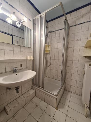 a bathroom with a shower and a sink at Strandhotel Wohnung 2 in Dahme