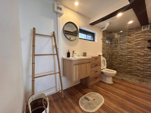 a bathroom with a ladder and a sink and a toilet at Bang Kao Beachfront Villa in Nathon Bay