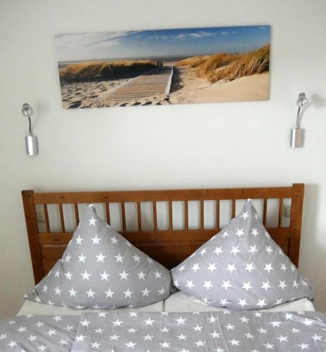 a bedroom with a bed with two pillows on it at Villa Baltica Wohnung 01 in Dahme