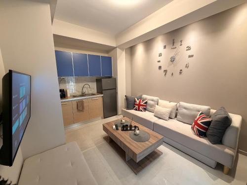 a living room with a couch and a table at Aggelos Room 1 in Volos