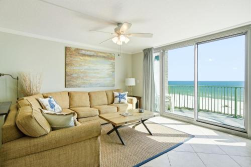a living room with a couch and a view of the ocean at Perdido Towers East 502 in Perdido Key