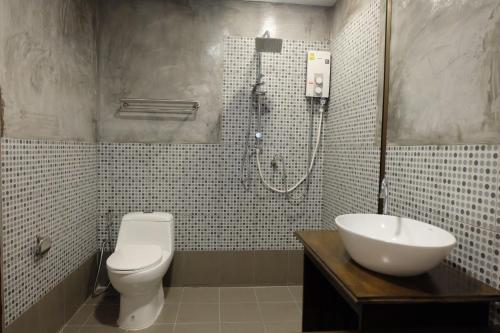 Ванная комната в A Plus Deluxe Hotel