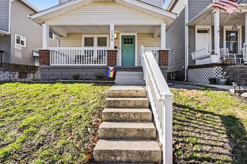 a house with a staircase leading to the front door at Cozy 2BR Near Ohio State - Private Yard - Parking in Columbus