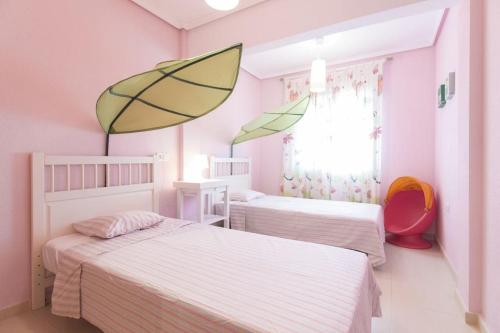 A bed or beds in a room at Brisa del Mar