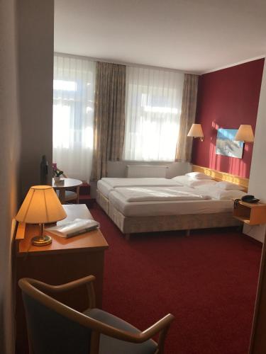 Ένα ή περισσότερα κρεβάτια σε δωμάτιο στο Hotel Waldperle