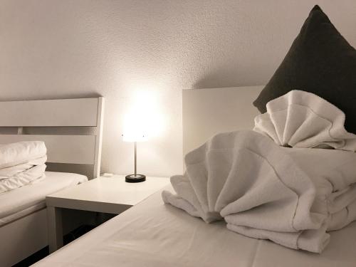 Ένα ή περισσότερα κρεβάτια σε δωμάτιο στο INSIDE FIVE - City Apartments