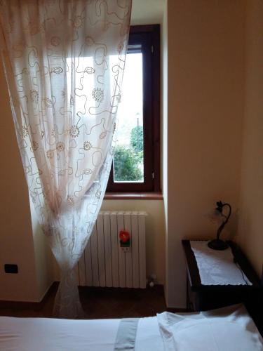 Ένα ή περισσότερα κρεβάτια σε δωμάτιο στο Agriturismo Il Melo