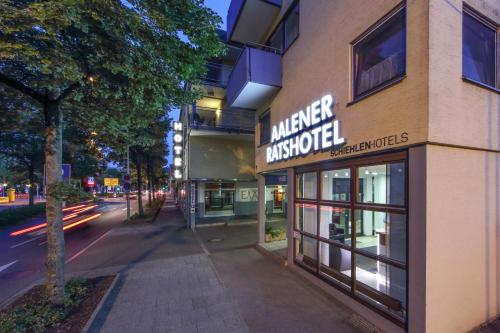 a building with a sign that reads manager audiologist at Ratshotel - City Aparthotel Aalen in Aalen