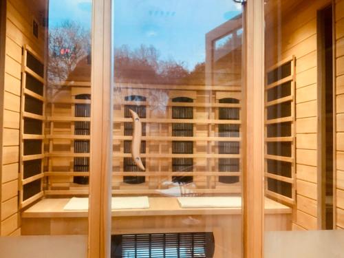 a window with a view of a building at Chalet La Bohème in Prouilly